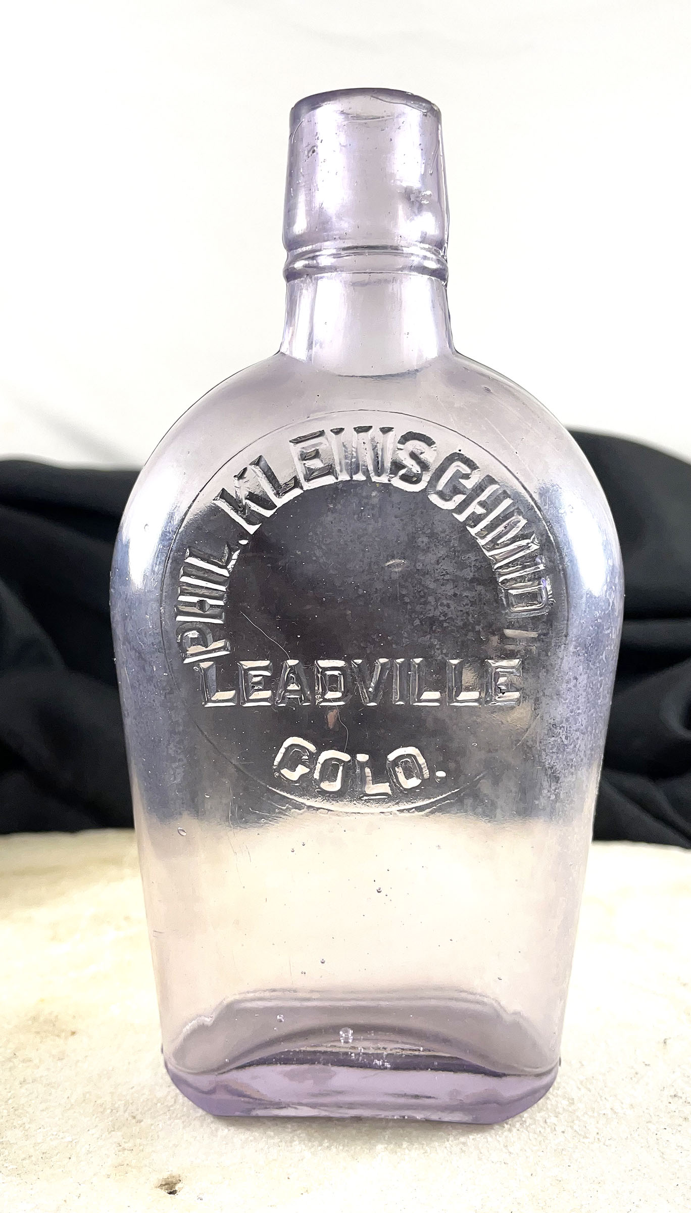 PHIL KLEINSCHMIDT, LEADVILLE, COLORADO pint whiskey bottle, 1900